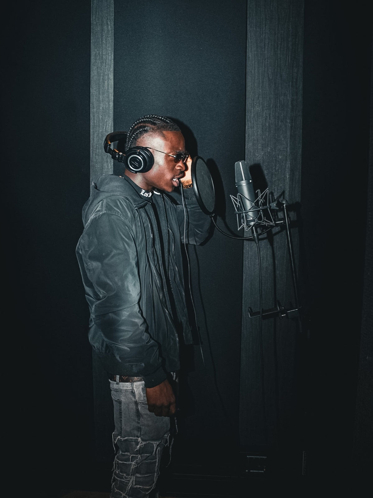 Artist recording vocals in the booth